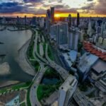 drone-shot-of-panama-citys-skyline-and-coastline-during-sunset-showcasing-skyscrapers-and-vibrant-city-life.-14782642-1536x2048